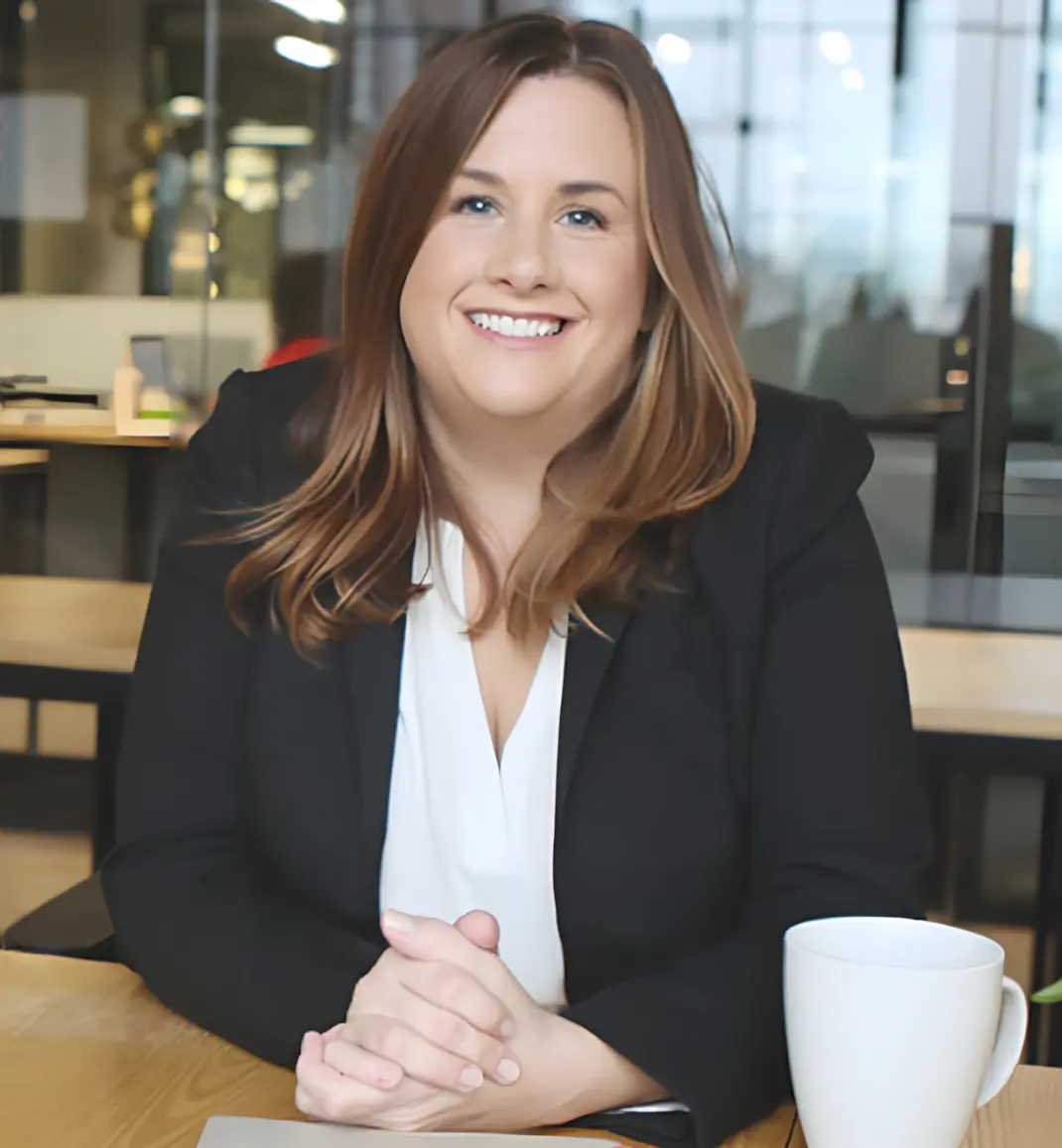 Laura Wester sitting behind an office desk